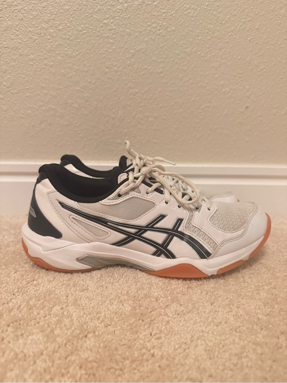 Asics Gel-Rocket volleyball shoes with black accents and a gum rubber sole